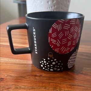 Starbucks Black Mug with Red and White Patterns